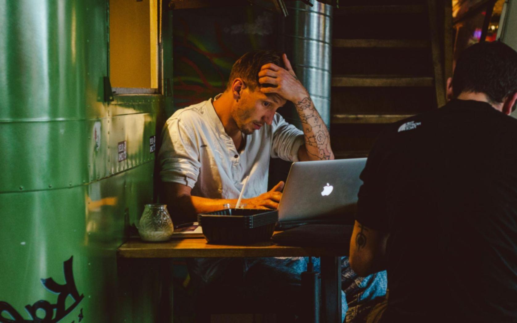 Team meeting analyzing budget optimization results and planning next steps